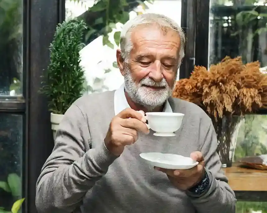 old man drinking coffee